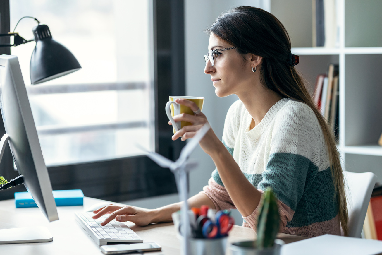 Concentrated Young Business Woman Working with Computer While Dr